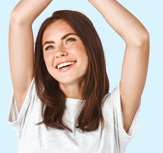 Woman raising her arms confidently